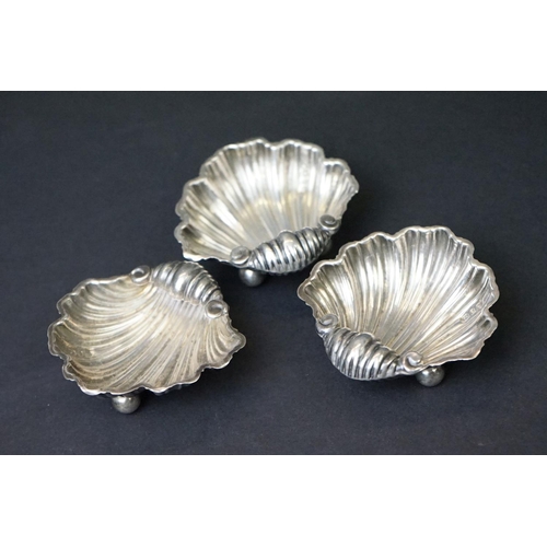 455 - Victorian set of three silver salts in the form of clam shells, each raised on three bun feet, with ... 