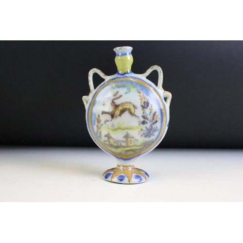 5 - Three pieces of continental faience maiolica ceramics to include a moon flask vase featuring a hare,... 