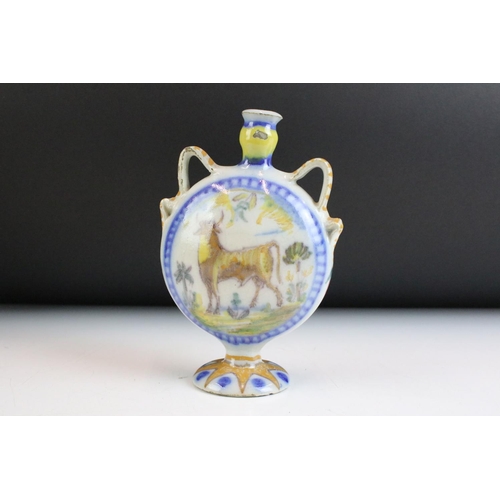 5 - Three pieces of continental faience maiolica ceramics to include a moon flask vase featuring a hare,... 