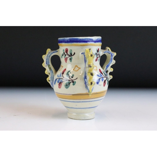 5 - Three pieces of continental faience maiolica ceramics to include a moon flask vase featuring a hare,... 