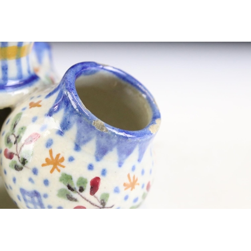 5 - Three pieces of continental faience maiolica ceramics to include a moon flask vase featuring a hare,... 