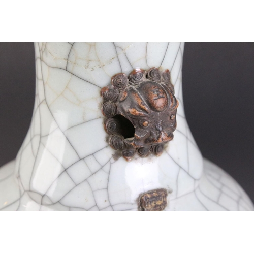 33 - Chinese 19th Century celadon crackle glaze vase together with an 18th Century famille rose teapot wi... 