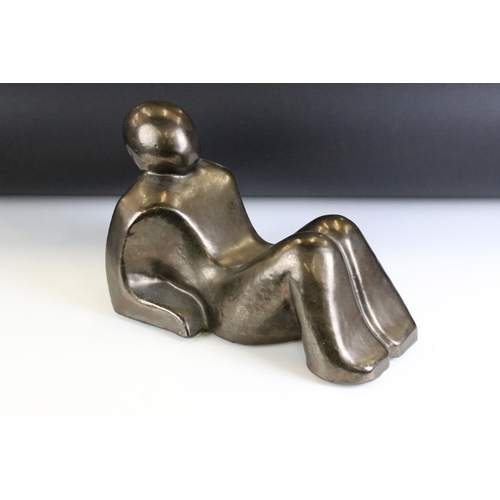 123 - Ceramic modernist sculpture in the form of a stylised recumbent figure. Unsigned. Measures 34cm wide... 