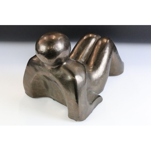 123 - Ceramic modernist sculpture in the form of a stylised recumbent figure. Unsigned. Measures 34cm wide... 