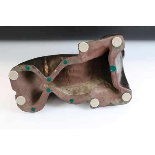 123 - Ceramic modernist sculpture in the form of a stylised recumbent figure. Unsigned. Measures 34cm wide... 