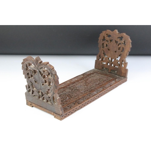 126 - Early 20th Century treen ware book slide having carved folding leaves with extendable base with flor... 