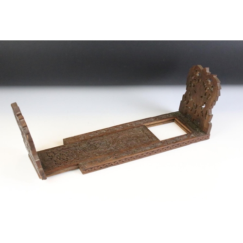 126 - Early 20th Century treen ware book slide having carved folding leaves with extendable base with flor... 