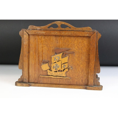 130 - Early 20th Century oak desk top chest of drawers / desk tidy having a sliding panel to the front wit... 
