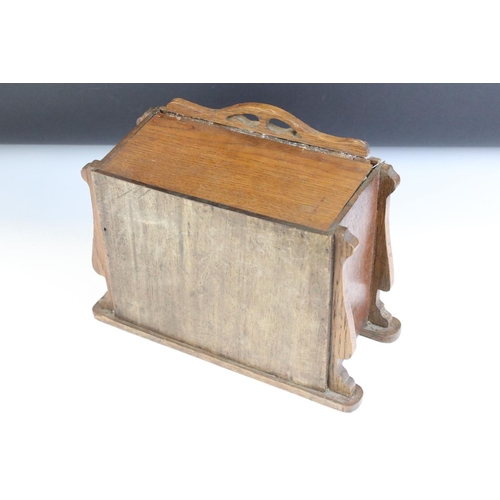 130 - Early 20th Century oak desk top chest of drawers / desk tidy having a sliding panel to the front wit... 