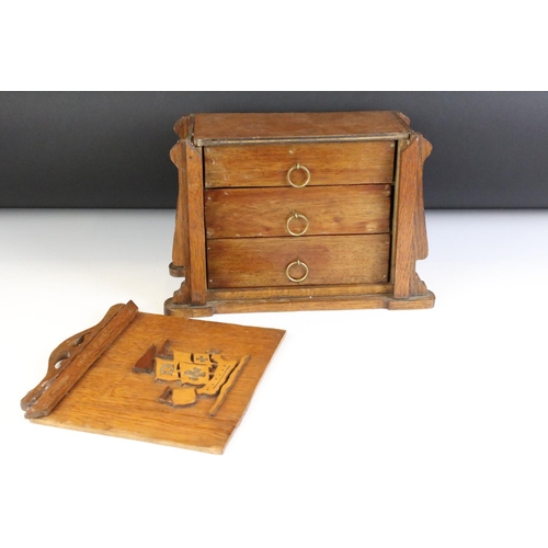 130 - Early 20th Century oak desk top chest of drawers / desk tidy having a sliding panel to the front wit... 