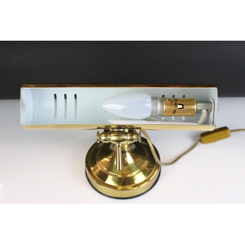 132 - Brass bankers style lamp having a round base with adjustable arm and cylindrical brass shade to the ... 
