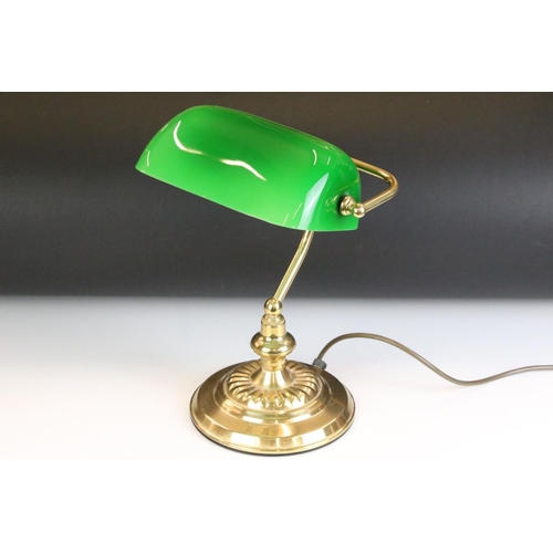133 - Brass bankers style lamp having a round stepped base with a green shade to the top. Measures 37cm ta... 