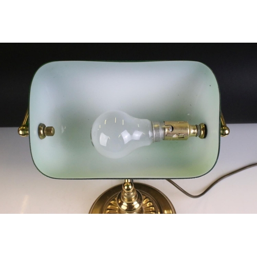 133 - Brass bankers style lamp having a round stepped base with a green shade to the top. Measures 37cm ta... 