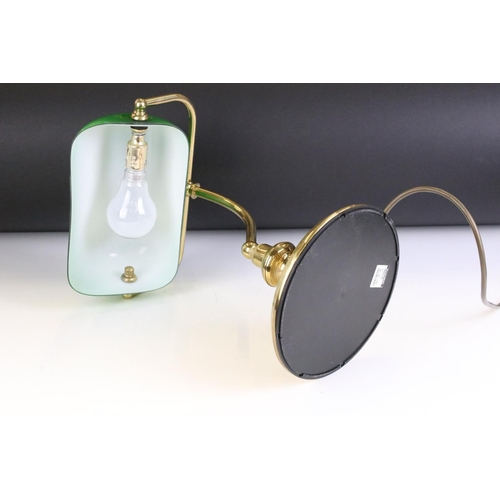 133 - Brass bankers style lamp having a round stepped base with a green shade to the top. Measures 37cm ta... 