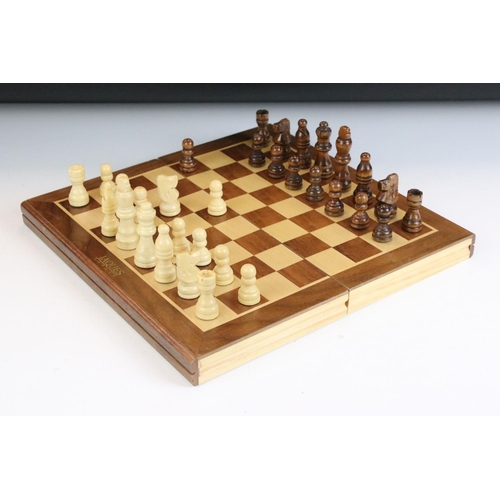 134 - Jaques London folding wooden chess board having a full set of matching turned wooden chess pieces. K... 