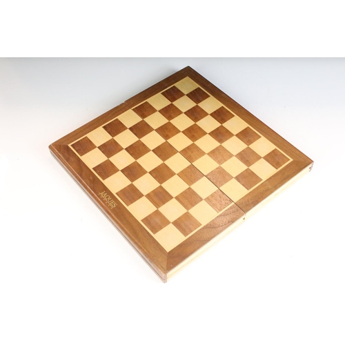 134 - Jaques London folding wooden chess board having a full set of matching turned wooden chess pieces. K... 
