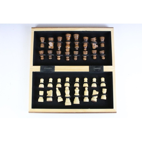 134 - Jaques London folding wooden chess board having a full set of matching turned wooden chess pieces. K... 