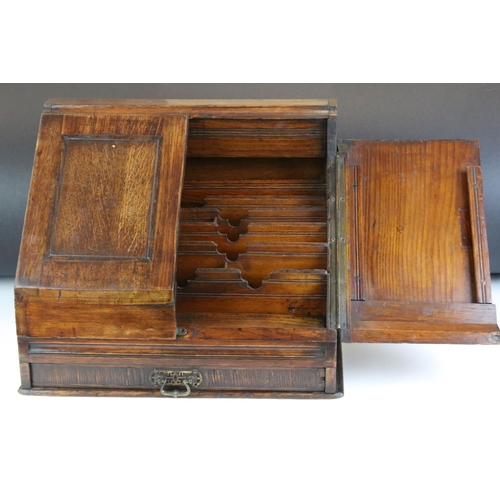 140 - 19th century oak stationery cabinet with fold-out doors, lower drawer with brass drop handle, and in... 