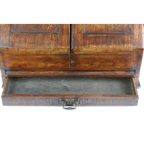 140 - 19th century oak stationery cabinet with fold-out doors, lower drawer with brass drop handle, and in... 