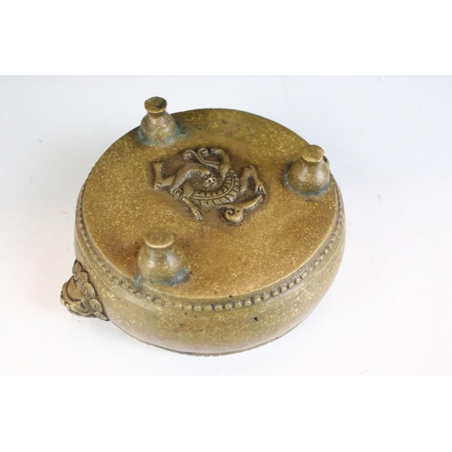 143 - Chinese twin-handled bronze censer, of circular form, handles modelled as lion masks, raised upon th... 