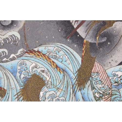 146 - Chinese cloisonne charger decorated with a dragon amongst waves and clouds, floral decoration on blu... 