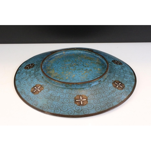 146 - Chinese cloisonne charger decorated with a dragon amongst waves and clouds, floral decoration on blu... 