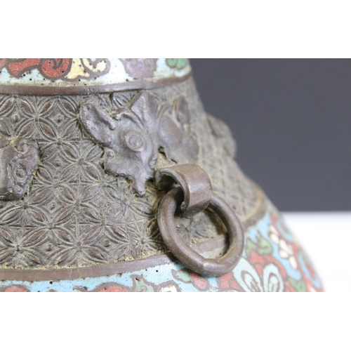 151 - Chinese bronze champleve enamel twin-handled vase of squat baluster form, the enamel bands with flor... 