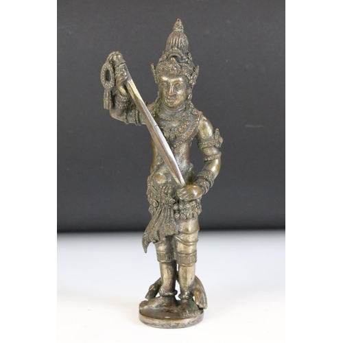154 - Hindu bronze figure of a deity stood holding a weapon, approx 19cm high