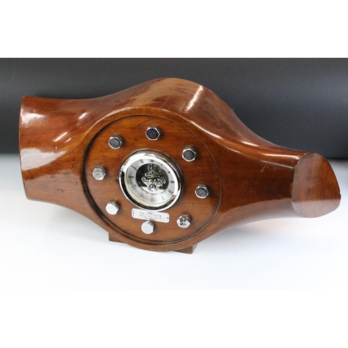 158 - Militaria - A mahogany aeroplane propeller boss clock with central open skeleton silvered dial, pres... 