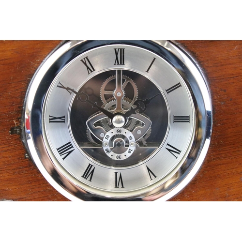 158 - Militaria - A mahogany aeroplane propeller boss clock with central open skeleton silvered dial, pres... 