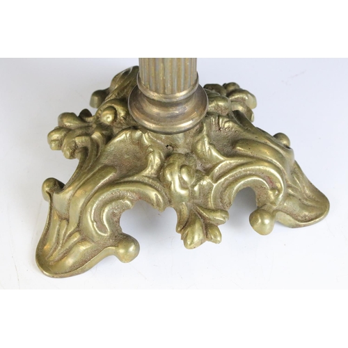 175 - 19th Century Victorian brass and glass oil lamp having a clear glass reservoir raised on a brass col... 