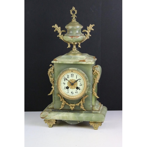 147 - Late 19th century onyx & gilt metal clock garniture, the clock with cream dial and surmounted by a t... 