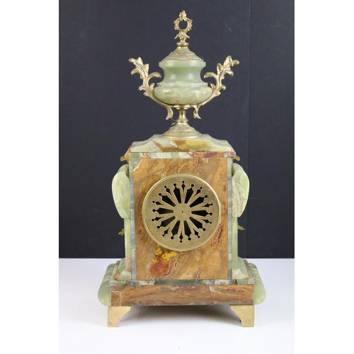 147 - Late 19th century onyx & gilt metal clock garniture, the clock with cream dial and surmounted by a t... 