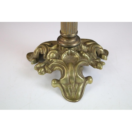 175 - 19th Century Victorian brass and glass oil lamp having a clear glass reservoir raised on a brass col... 