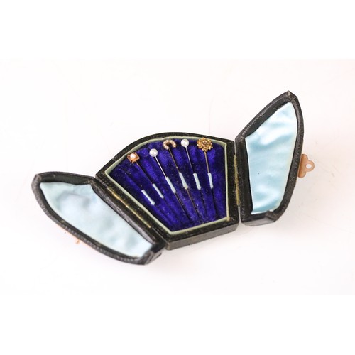 100A - Five tie pins to include diamond 15ct gold pin, small rose cut diamond, the stick broken, a seed pea... 