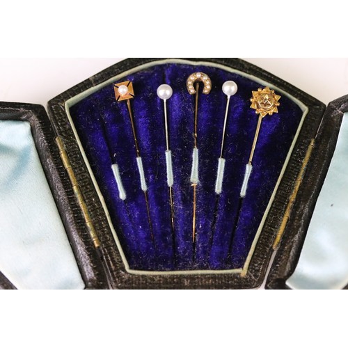 100A - Five tie pins to include diamond 15ct gold pin, small rose cut diamond, the stick broken, a seed pea... 