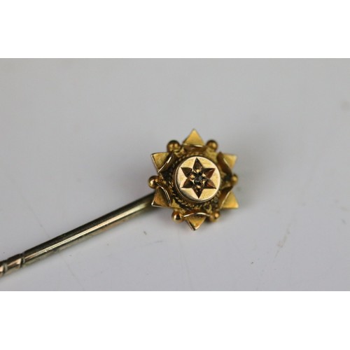 100A - Five tie pins to include diamond 15ct gold pin, small rose cut diamond, the stick broken, a seed pea... 