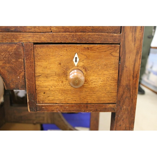 495 - George III Oak Lowboy or Side Table, with an arrangement of three drawers and shaped apron, raised o... 