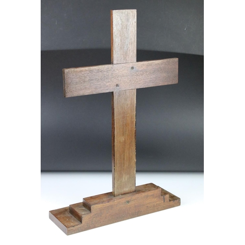 174 - Wooden cross mounted on a stepped base, 59cm high