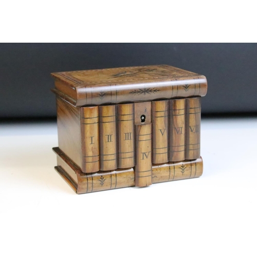 122 - Italian carved olive wood puzzle box inlaid with marquetry bird. Measures approx 13.5cm wide