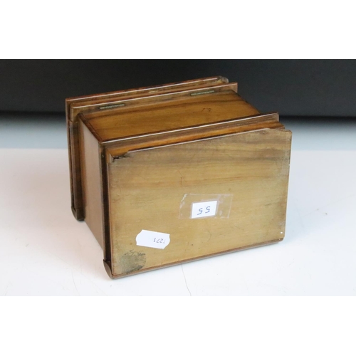 122 - Italian carved olive wood puzzle box inlaid with marquetry bird. Measures approx 13.5cm wide