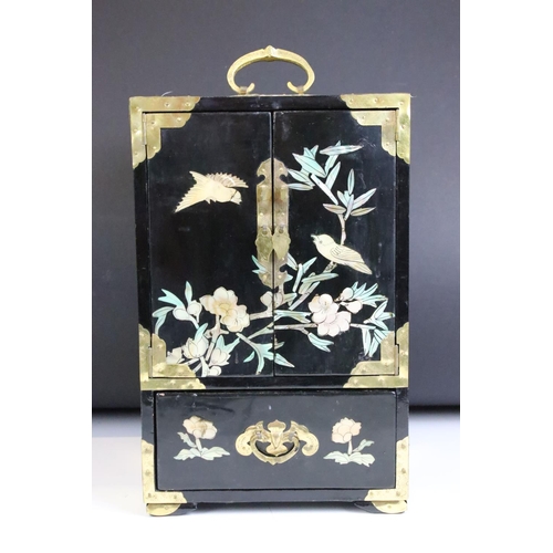 125 - Chinese black lacquered jewellery cabinet with MOP and abalone shell inlay depicting birds perched u... 