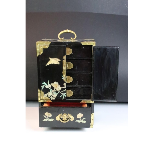 125 - Chinese black lacquered jewellery cabinet with MOP and abalone shell inlay depicting birds perched u... 