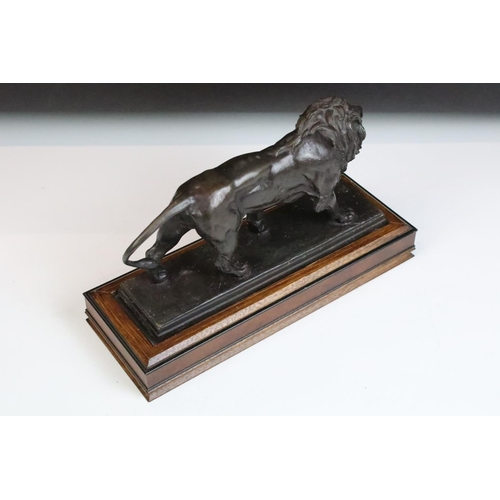 127 - The Franklin Mint 'Lion Qui Marche' bronze figure of a prowling lion by Antoine-Louis Barye, stamped... 