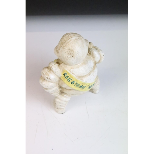 128 - Advertising - A cast iron Michelin man figure, marked 'Reg. 67548 Detroit' to reverse (approx 15cm h... 