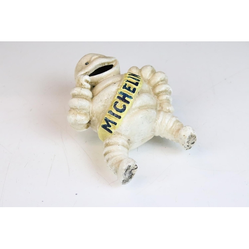 128 - Advertising - A cast iron Michelin man figure, marked 'Reg. 67548 Detroit' to reverse (approx 15cm h... 