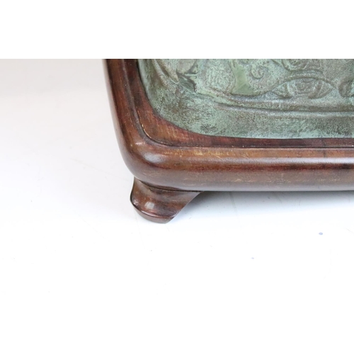 136 - Chinese archaic style bronze lamp, of square baluster form with flanking mask drop handles, raised o... 