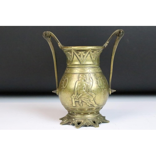 138 - Bronze twin-handled urn vase, cast in relief with a classical man and woman, fleur-de-lis style moti... 