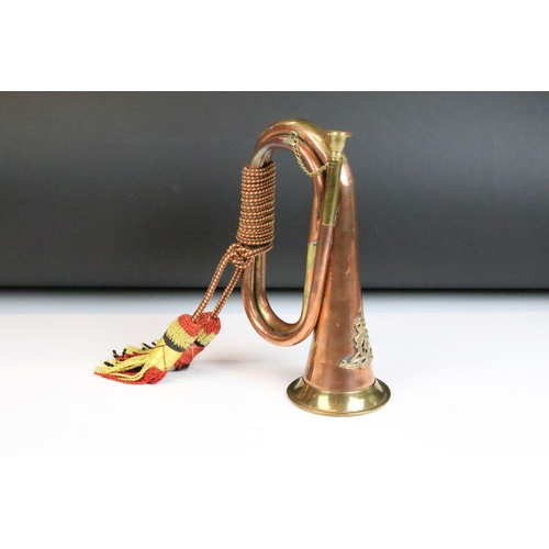 140 - Copper & brass bugle with applied Royal Artillery badge, braided cord tassels. Measures approx. 26cm... 