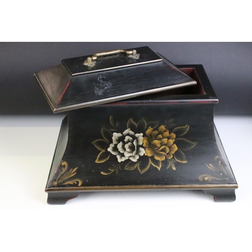 146 - A sarcophagus shaped black wooden box with hand painted decoration and velvet lined interior. Approx... 